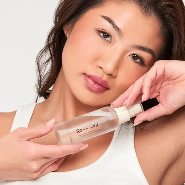 Model_holding_a_HALEYS_complexion_product.webp